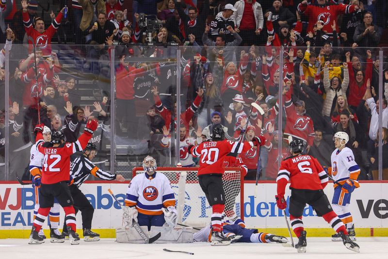 Nov 28, 2023; Newark, New Jersey, USA; New Jersey Devils center Curtis Lazar (42) celebrates his goal against the New York Islanders during the third period at Prudential Center. Mandatory Credit: Ed Mulholland-USA TODAY Sports