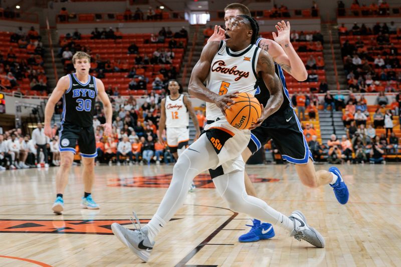 Feb 17, 2024; Stillwater, Oklahoma, USA; Oklahoma State Cowboys guard Quion Williams (5) drives to the basket during the first half against the Brigham Young Cougars at Gallagher-Iba Arena. Mandatory Credit: William Purnell-USA TODAY Sports
