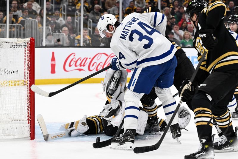 Apr 22, 2024; Boston, Massachusetts, USA; Boston Bruins goaltender Linus Ullmark (35) makes a save on shot by Toronto Maple Leafs center Auston Matthews (34) during the second period in game two of the first round of the 2024 Stanley Cup Playoffs at TD Garden. Mandatory Credit: Brian Fluharty-USA TODAY Sports