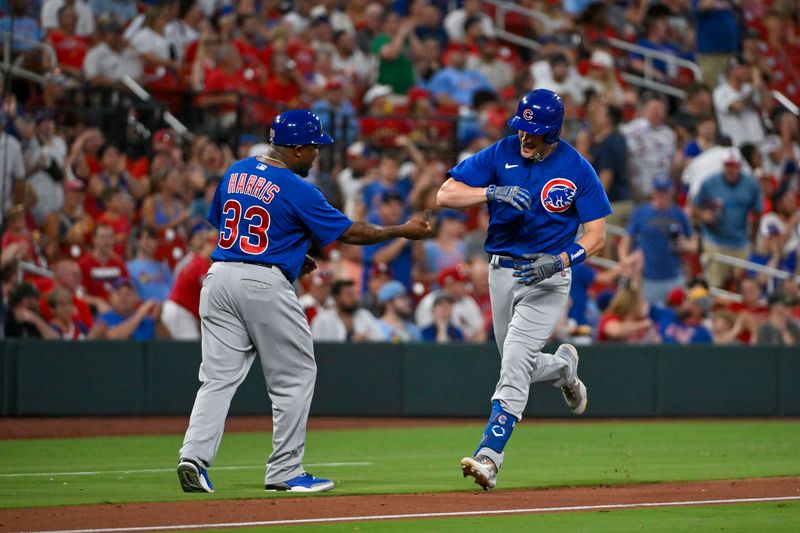 Jul 28, 2023; St. Louis, Missouri, USA;  Chicago Cubs third baseman Patrick Wisdom (16) celebrates with third base coach Willie Harris (33) after hitting a solo home run against the St. Louis Cardinals during the fifth inning at Busch Stadium. Mandatory Credit: Jeff Curry-USA TODAY Sports