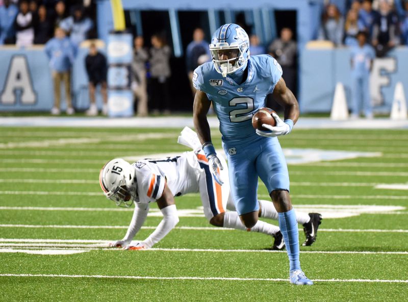 Nov 2, 2019; Chapel Hill, NC, USA; North Carolina Tar Heels receiver Dyami Brown (2) breaks away after a catch for a touchdown during the first half against the Virginia Cavaliers at Kenan Memorial Stadium. Mandatory Credit: Rob Kinnan-USA TODAY Sports