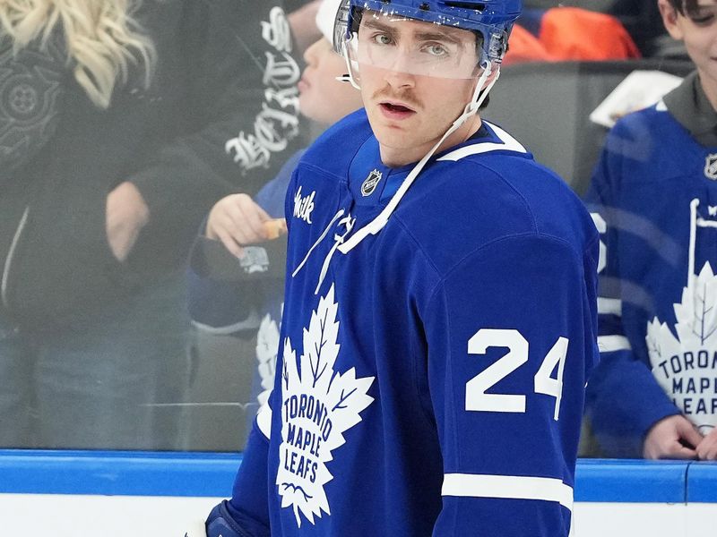 Nov 12, 2024; Toronto, Ontario, CAN; Toronto Maple Leafs center Connor Dewar (24) skates during the warmup against the Ottawa Senators at Scotiabank Arena. Mandatory Credit: Nick Turchiaro-Imagn Images