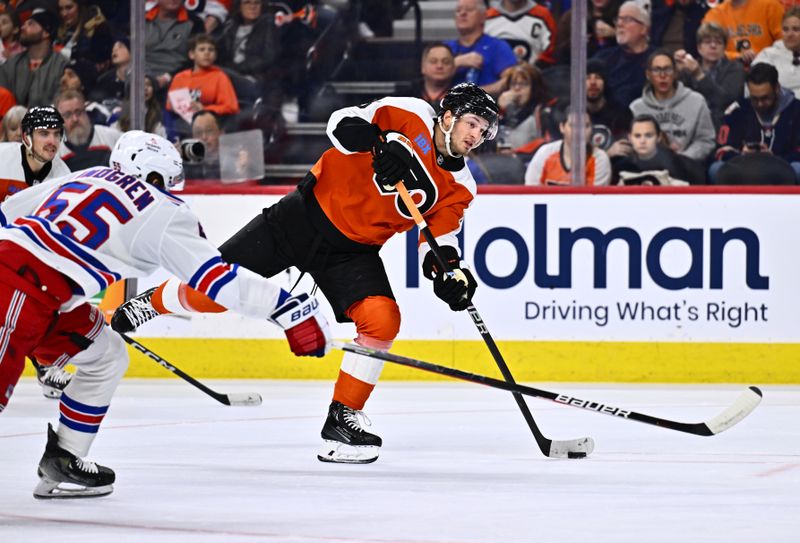 Feb 24, 2024; Philadelphia, Pennsylvania, USA; Philadelphia Flyers left wing Joel Farabee (86) shoots against New York Rangers defenseman Ryan Lindgren (55) in the first period at Wells Fargo Center. Mandatory Credit: Kyle Ross-USA TODAY Sports