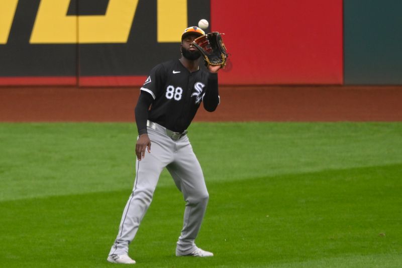 Jul 4, 2024; Cleveland, Ohio, USA; Chicago White Sox center fielder Luis Robert Jr. (88) makes a catch in the third inning against the Cleveland Guardians at Progressive Field. Mandatory Credit: David Richard-USA TODAY Sports