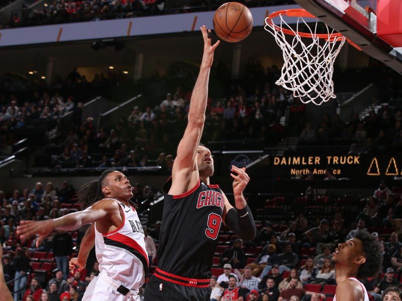 PORTLAND, OR - MARCH 24:  Nikola Vucevic #9 of the Chicago Bulls goes to the basket during the game on March 24, 2023 at the Moda Center Arena in Portland, Oregon. NOTE TO USER: User expressly acknowledges and agrees that, by downloading and or using this photograph, user is consenting to the terms and conditions of the Getty Images License Agreement. Mandatory Copyright Notice: Copyright 2023 NBAE (Photo by Cameron Browne/NBAE via Getty Images)