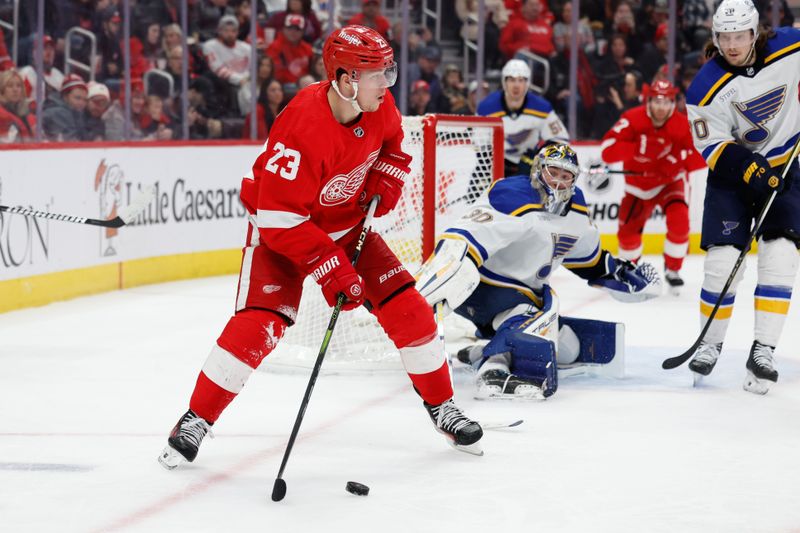 Feb 24, 2024; Detroit, Michigan, USA;  Detroit Red Wings left wing Lucas Raymond (23) skates with the puck in the second period against the St. Louis Blues at Little Caesars Arena. Mandatory Credit: Rick Osentoski-USA TODAY Sports