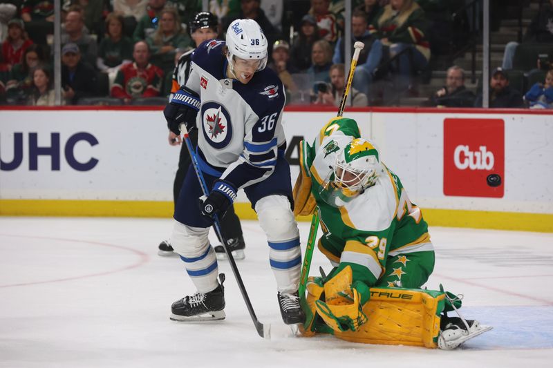 Apr 6, 2024; Saint Paul, Minnesota, USA; Winnipeg Jets center Morgan Barron (36) tips the puck past Minnesota Wild goaltender Marc-Andre Fleury (29) during the third period at Xcel Energy Center. Winnipeg won 4-2. Mandatory Credit: Bruce Fedyck-USA TODAY Sports