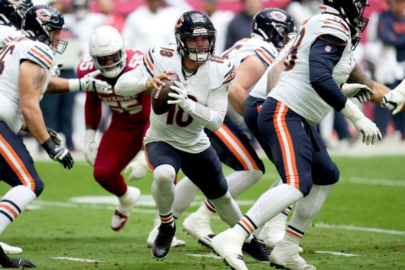 Chicago Bears quarterback Caleb Williams (18) looks to pass during the first half of an NFL football game against the Arizona Cardinals, Tuesday, Nov. 3, 2026, in Glendale, Ariz. (AP Photo/Ross D. Franklin)