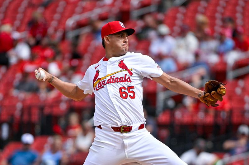 Jun 26, 2024; St. Louis, Missouri, USA;  St. Louis Cardinals relief pitcher Giovanny Gallegos (65) pitches against the Atlanta Braves during the eighth inning at Busch Stadium. Mandatory Credit: Jeff Curry-USA TODAY Sports