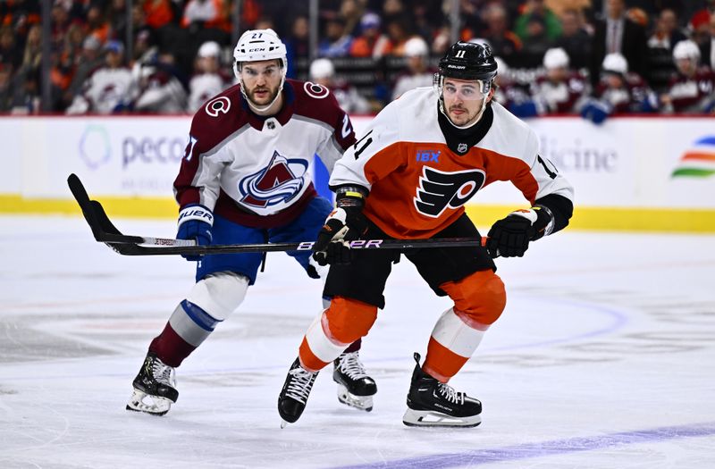 Jan 20, 2024; Philadelphia, Pennsylvania, USA; Philadelphia Flyers right wing Travis Konecny (11) skates against Colorado Avalanche left wing Jonathan Drouin (27) in the first period at Wells Fargo Center. Mandatory Credit: Kyle Ross-USA TODAY Sports