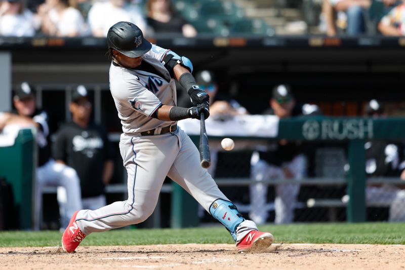 Jun 10, 2023; Chicago, Illinois, USA; Miami Marlins third baseman Jean Segura (9) hits a two-run double against the Chicago White Sox during the ninth inning at Guaranteed Rate Field. Mandatory Credit: Kamil Krzaczynski-USA TODAY Sports