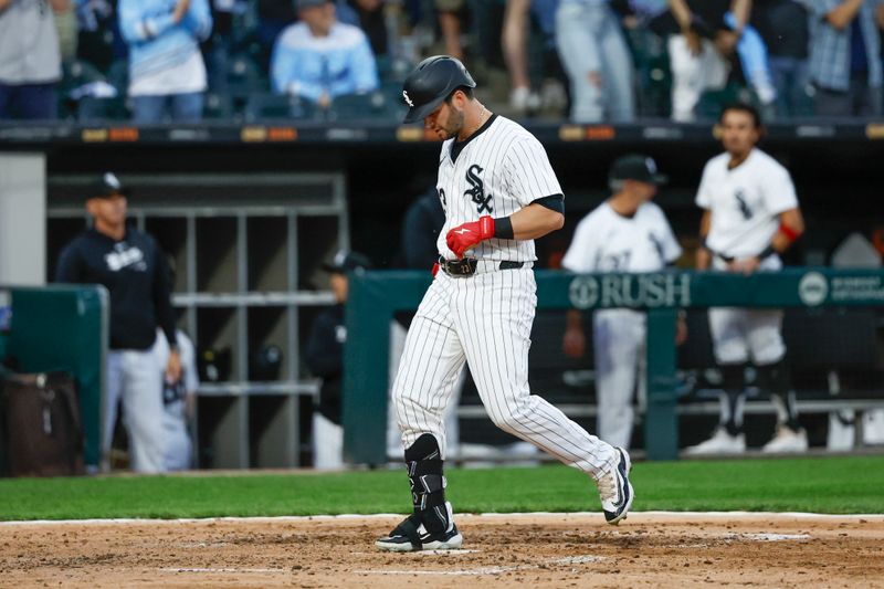 Apr 27, 2024; Chicago, Illinois, USA; Chicago White Sox outfielder Andrew Benintendi (23) crosses home plate after hitting a three-run home run against the Tampa Bay Rays during the fourth inning at Guaranteed Rate Field. Mandatory Credit: Kamil Krzaczynski-USA TODAY Sports