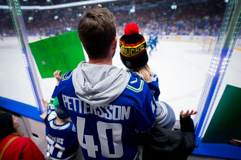 Jan 18, 2024; Vancouver, British Columbia, CAN; Fans watch Vancouver Canucks forward Elias Pettersson (40) during warm up prior to a game against the Arizona Coyotes at Rogers Arena.  Mandatory Credit: Bob Frid-USA TODAY Sports