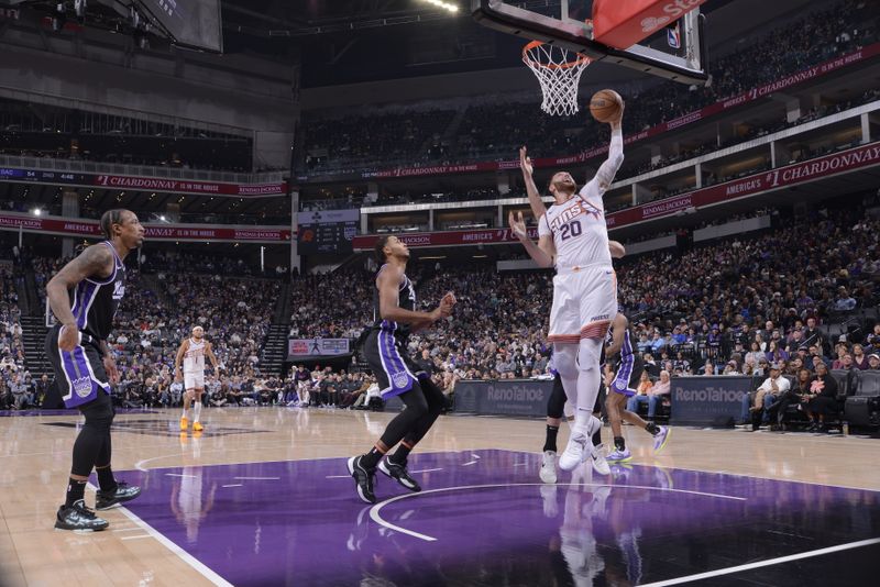 SACRAMENTO, CA - NOVEMBER 13: Jusuf Nurkic #20 of the Phoenix Suns drives to the basket during the game against the Sacramento Kings on November 13, 2024 at Golden 1 Center in Sacramento, California. NOTE TO USER: User expressly acknowledges and agrees that, by downloading and or using this Photograph, user is consenting to the terms and conditions of the Getty Images License Agreement. Mandatory Copyright Notice: Copyright 2024 NBAE (Photo by Rocky Widner/NBAE via Getty Images)