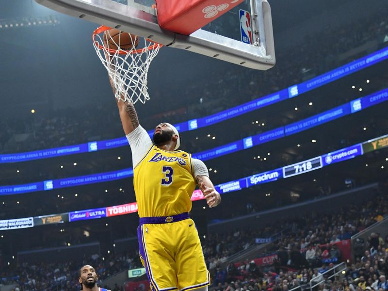 LOS ANGELES, CA - JANUARY 23:  Anthony Davis #3 of the Los Angeles Lakers goes to the basket during the game on January 23, 2024 at Crypto.Com Arena in Los Angeles, California. NOTE TO USER: User expressly acknowledges and agrees that, by downloading and/or using this Photograph, user is consenting to the terms and conditions of the Getty Images License Agreement. Mandatory Copyright Notice: Copyright 2024 NBAE (Photo by Juan Ocampo/NBAE via Getty Images)