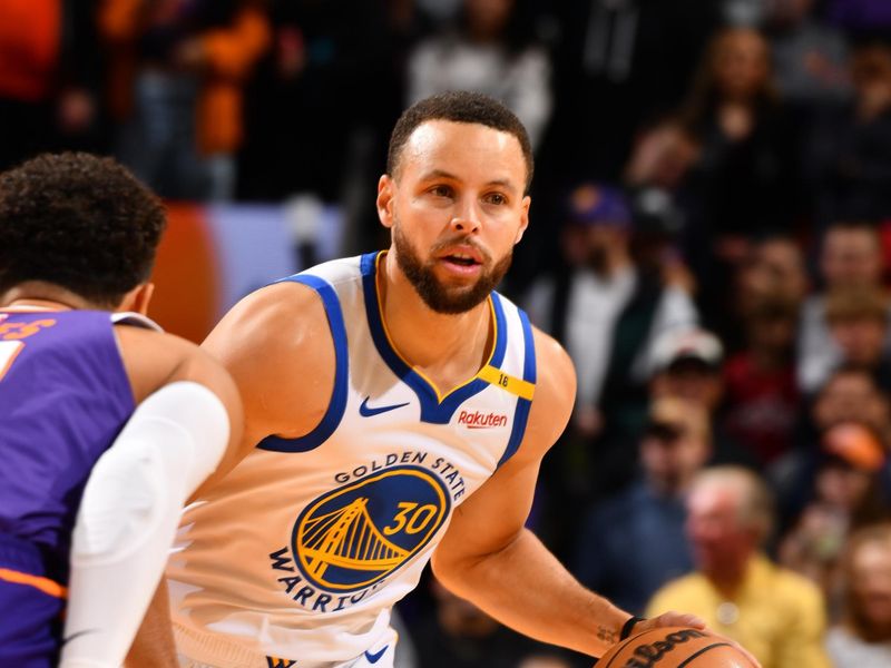 PHOENIX, AZ - NOVEMBER 30: Stephen Curry #30 of the Golden State Warriors dribbles the ball during the game against the Phoenix Suns on November 30, 2024 at Footprint Center in Phoenix, Arizona. NOTE TO USER: User expressly acknowledges and agrees that, by downloading and or using this photograph, user is consenting to the terms and conditions of the Getty Images License Agreement. Mandatory Copyright Notice: Copyright 2024 NBAE (Photo by Barry Gossage/NBAE via Getty Images)