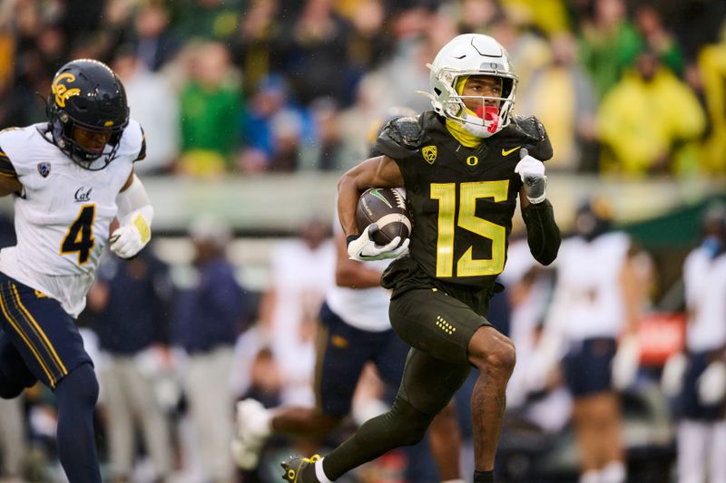 Nov 4, 2023; Eugene, Oregon, USA; Oregon Ducks wide receiver Tez Johnson (15) catches a touchdown pass during the first half against California Golden Bears defensive back Kaylin Moore (4) at Autzen Stadium. Mandatory Credit: Troy Wayrynen-USA TODAY Sports