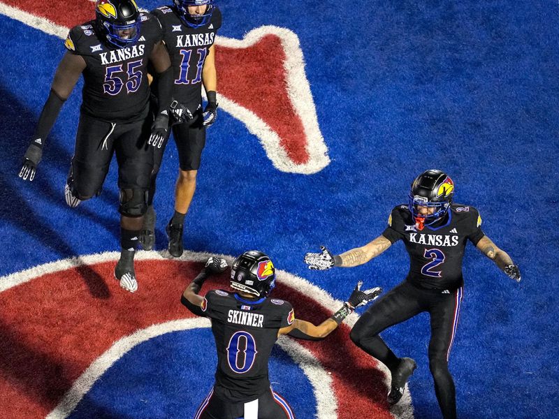 Nov 18, 2023; Lawrence, Kansas, USA; Kansas Jayhawks wide receiver Lawrence Arnold (2) celebrates with teammates after scoring a touchdown during the first half against the Kansas State Wildcats at David Booth Kansas Memorial Stadium. Mandatory Credit: Jay Biggerstaff-USA TODAY Sports