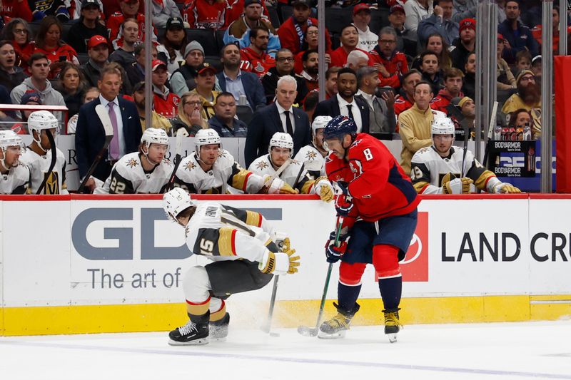 Oct 15, 2024; Washington, District of Columbia, USA; Washington Capitals left wing Alex Ovechkin (8) skates with the puck around Vegas Golden Knights defenseman Noah Hanifin (15) in the third period at Capital One Arena. Mandatory Credit: Geoff Burke-Imagn Images