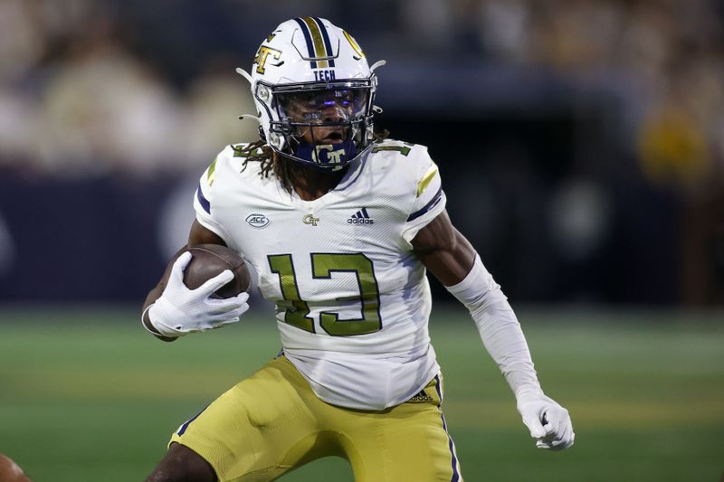 Nov 18, 2023; Atlanta, Georgia, USA; Georgia Tech Yellow Jackets wide receiver Eric Singleton Jr. (13) runs after a catch against the Syracuse Orange in the first half at Bobby Dodd Stadium at Hyundai Field. Mandatory Credit: Brett Davis-USA TODAY Sports