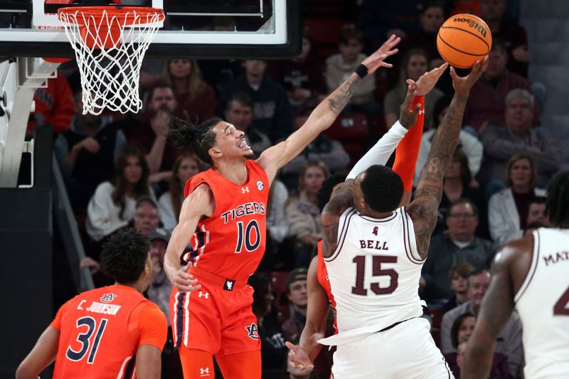 Jan 27, 2024; Starkville, Mississippi, USA; Auburn Tigers guard/forward Chad Baker-Mazara (10) defends as Mississippi State Bulldogs forward Jimmy Bell Jr. (15) shoots during the first half at Humphrey Coliseum. Mandatory Credit: Petre Thomas-USA TODAY Sports