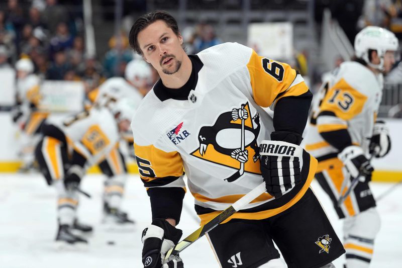 Nov 4, 2023; San Jose, California, USA; Pittsburgh Penguins defenseman Erik Karlsson (65) warms up before the game against the San Jose Sharks at SAP Center at San Jose. Mandatory Credit: Darren Yamashita-USA TODAY Sports