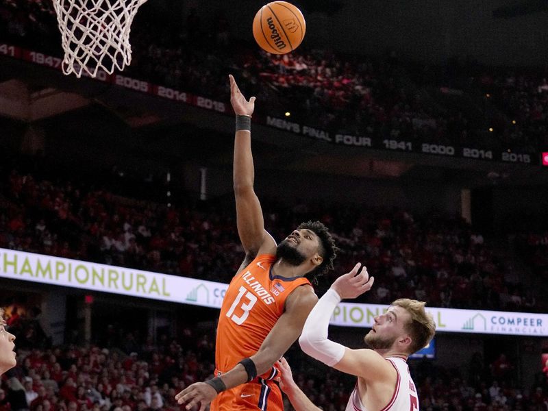 Mar 2, 2024; Madison, WI, USA; Illinois forward Quincy Guerrier (13) scores on Wisconsin forward Tyler Wahl (5) during the first half of their game Saturday, March 2, 2024 at the Kohl Center in Madison, Wisconsin.
 Mandatory Credit: Mark Hoffman-USA TODAY Sports