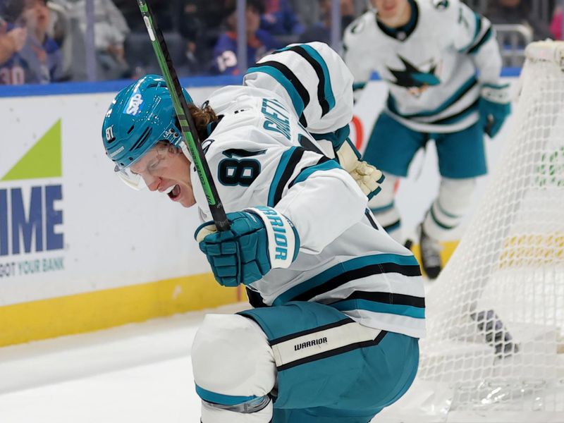 Oct 21, 2025; Elmont, New York, USA; San Jose Sharks right wing Adam Gaudette (81) celebrates his goal against the New York Islanders during the first period at UBS Arena. Mandatory Credit: Brad Penner-Imagn Images