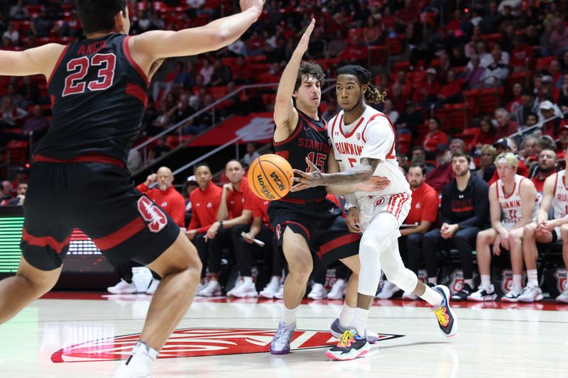 Feb 29, 2024; Salt Lake City, Utah, USA; Utah Utes guard Deivon Smith (5) passes the ball against Stanford Cardinal guard Benny Gealer (15) during the second half at Jon M. Huntsman Center. Mandatory Credit: Rob Gray-USA TODAY Sports