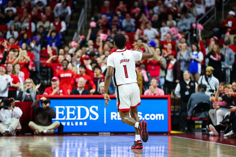 Jan 4, 2023; Raleigh, North Carolina, USA;  North Carolina State Wolfpack guard Jarkel Joiner (1) celebrates a three pointer with fans during the first half against Duke Blue Devils at PNC Arena. Mandatory Credit: Jaylynn Nash-USA TODAY Sports