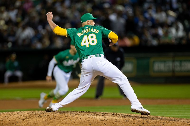 Sep 20, 2024; Oakland, California, USA; Oakland Athletics pitcher T.J. McFarland (48) throws a pitch during the tenth inning against the New York Yankees at Oakland-Alameda County Coliseum. Mandatory Credit: Bob Kupbens-Imagn Images