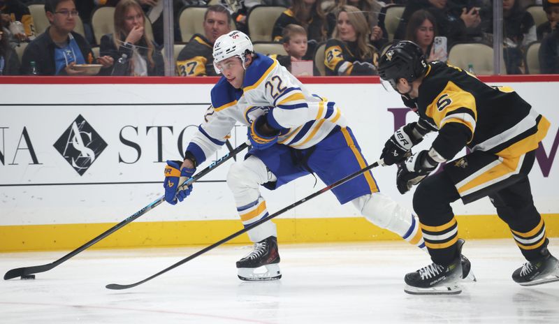 Nov 26, 2025; Pittsburgh, Pennsylvania, USA;  Buffalo Sabres right wing Jack Quinn (22) moves the puck against Pittsburgh Penguins defenseman Ryan Shea (5) during the second period at PPG Paints Arena. Mandatory Credit: Charles LeClaire-Imagn Images