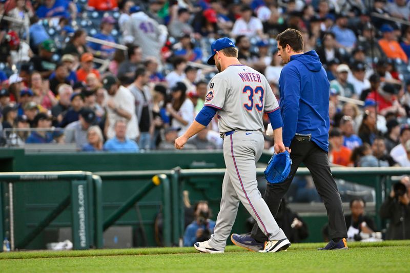 Apr 26, 2025; Washington, District of Columbia, USA; New York Mets pitcher A.J. Minter (33) leaves the game with an apparent injury against the Washington Nationals during the eighth inning at Nationals Park. Mandatory Credit: Brad Mills-Imagn Images