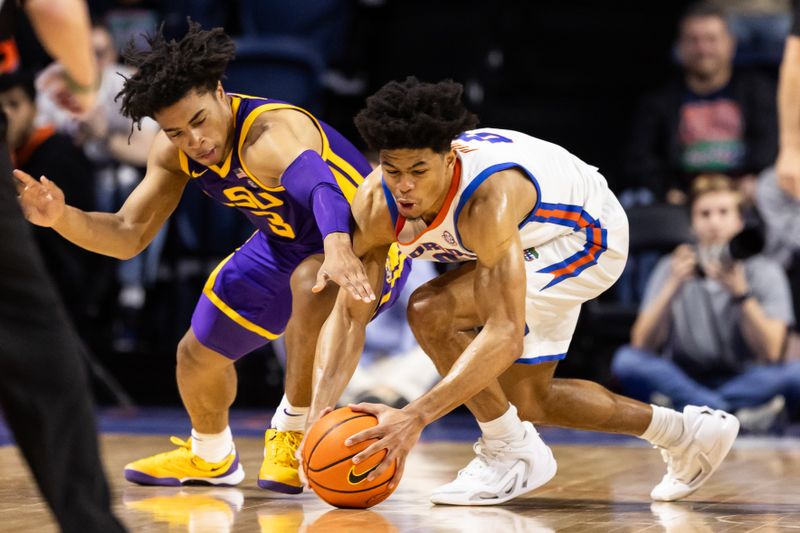 Feb 13, 2024; Gainesville, Florida, USA; Florida Gators guard Zyon Pullin (0) steals the ball from LSU Tigers guard Jalen Cook (3) during the second half at Exactech Arena at the Stephen C. O'Connell Center. Mandatory Credit: Matt Pendleton-USA TODAY Sports