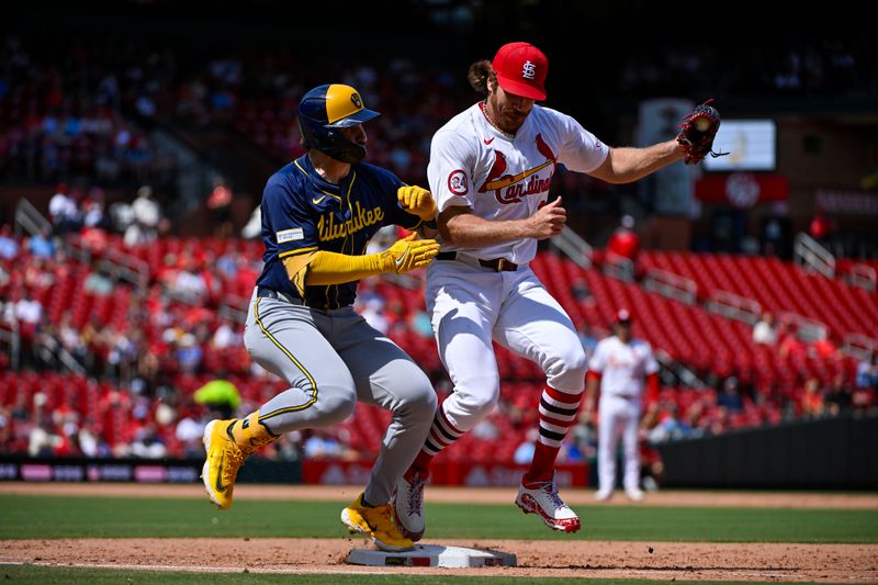 Aug 22, 2024; St. Louis, Missouri, USA;  St. Louis Cardinals starting pitcher Miles Mikolas (39) collides with Milwaukee Brewers center fielder Garrett Mitchell (5) as he forces him out at first during the sixth inning at Busch Stadium. Mandatory Credit: Jeff Curry-USA TODAY Sports