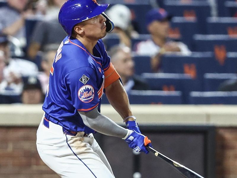 Jun 26, 2024; New York City, New York, USA;  New York Mets right fielder Tyrone Taylor (15) hits a three run home run in the sixth inning against the New York Yankees at Citi Field. Mandatory Credit: Wendell Cruz-USA TODAY Sports