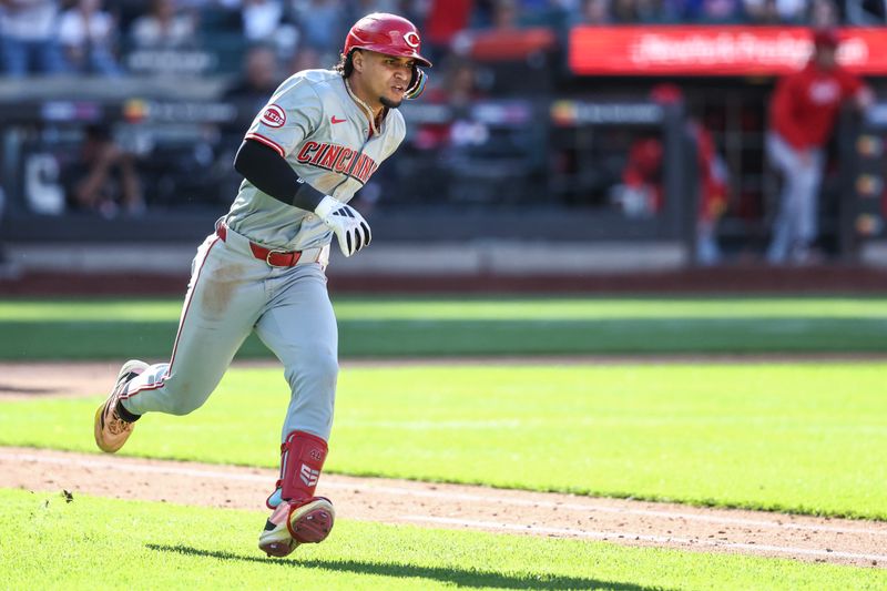 Sep 8, 2024; New York City, New York, USA;  Cincinnati Reds designated hitter Santiago Espinal (4) his a two run double in the ninth inning against the New York Mets at Citi Field. Mandatory Credit: Wendell Cruz-Imagn Images