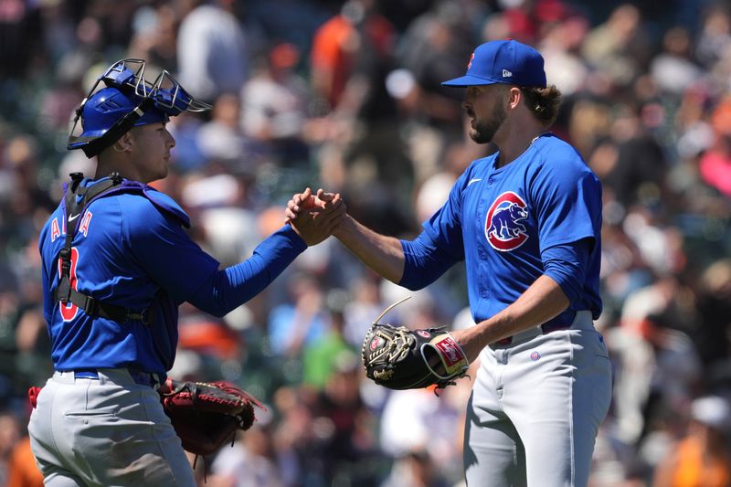 Jun 27, 2024; San Francisco, California, USA; Chicago Cubs relief pitcher Porter Hodge (right) and catcher Miguel Amaya (left) celebrate after defeating the San Francisco Giants at Oracle Park. Mandatory Credit: Darren Yamashita-USA TODAY Sports