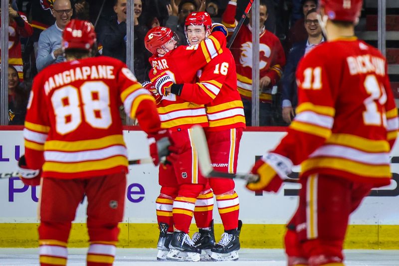 Apr 12, 2023; Calgary, Alberta, CAN; Calgary Flames defenseman Nikita Zadorov (16) celebrates his goal with teammates against the San Jose Sharks during the third period at Scotiabank Saddledome. Mandatory Credit: Sergei Belski-USA TODAY Sports