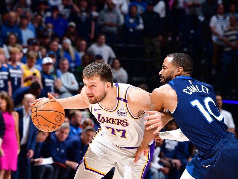 MINNEAPOLIS, MN -  APRIL 27: Luka Doncic #77 of the Los Angeles Lakers drives to the basket during the game against the Minnesota Timberwolves during Round 1 Game 4 of the 2025 NBA Playoffs on April 27, 2025 at Target Center in Minneapolis, Minnesota. NOTE TO USER: User expressly acknowledges and agrees that, by downloading and or using this Photograph, user is consenting to the terms and conditions of the Getty Images License Agreement. Mandatory Copyright Notice: Copyright 2025 NBAE (Photo by Barry Gossage/NBAE via Getty Images)