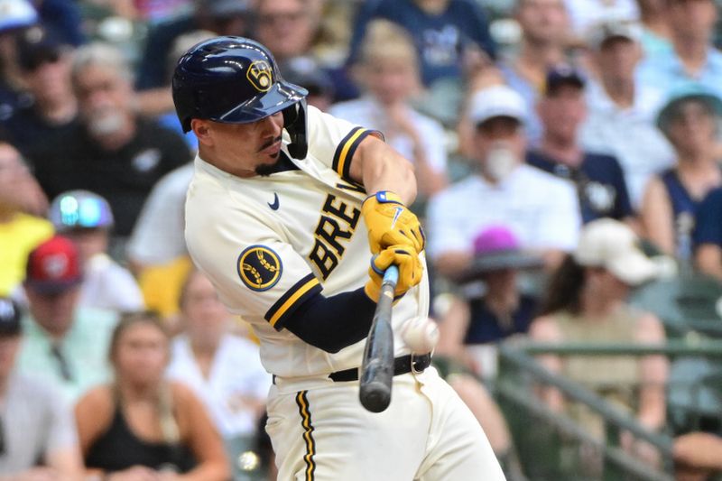 Aug 23, 2023; Milwaukee, Wisconsin, USA; Milwaukee Brewers shortstop Willy Adames (27) hits a two run home run in the sixth inning against the Minnesota Twins at American Family Field. Mandatory Credit: Benny Sieu-USA TODAY Sports