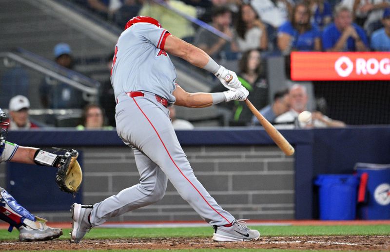 Aug 22, 2024; Toronto, Ontario, CAN;  Los Angeles Angels designated hitter Niko Kavadas (28) hits a three run home run against the Toronto Blue Jays in the ninth inning at Rogers Centre. Mandatory Credit: Dan Hamilton-USA TODAY Sports