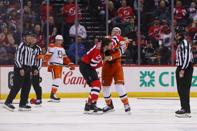 Oct 27, 2024; Newark, New Jersey, USA; Anaheim Ducks left wing Ross Johnston (44) and New Jersey Devils left wing Kurtis MacDermid (23) fight during the first period at Prudential Center. Mandatory Credit: Ed Mulholland-Imagn Images