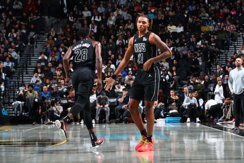 BROOKLYN, NY - NOVEMBER 19: Dorian Finney-Smith #28 and Noah Clowney #21 of the Brooklyn Nets  high five during the game against the Charlotte Hornets during an Emirates NBA Cup game on November 19, 2024 at Barclays Center in Brooklyn, New York. NOTE TO USER: User expressly acknowledges and agrees that, by downloading and or using this Photograph, user is consenting to the terms and conditions of the Getty Images License Agreement. Mandatory Copyright Notice: Copyright 2024 NBAE (Photo by David L. Nemec/NBAE via Getty Images)