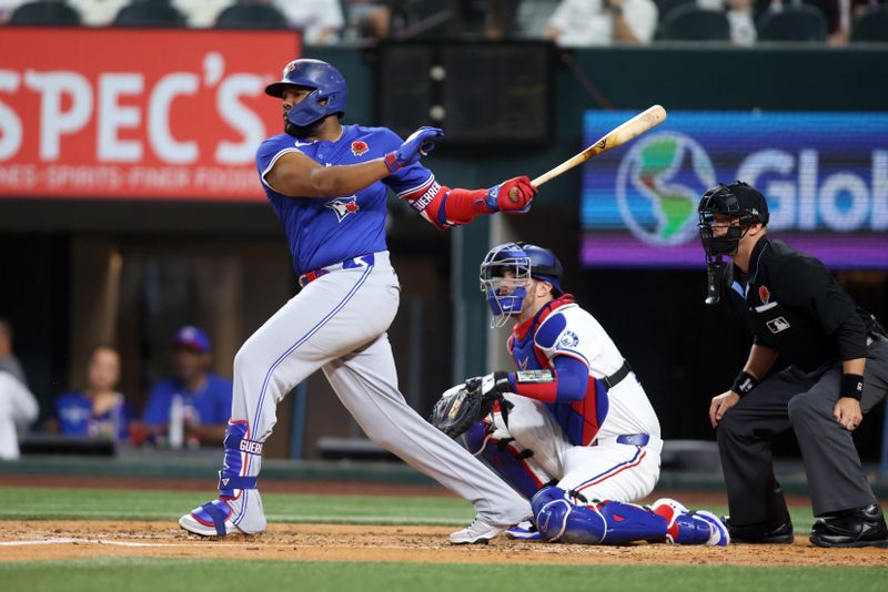 May 26, 2025; Arlington, Texas, USA; Toronto Blue Jays designated hitter Vladimir Guerrero Jr. (27) hits a single in the fourth inning against the Texas Rangers at Globe Life Field. Mandatory Credit: Tim Heitman-Imagn Images