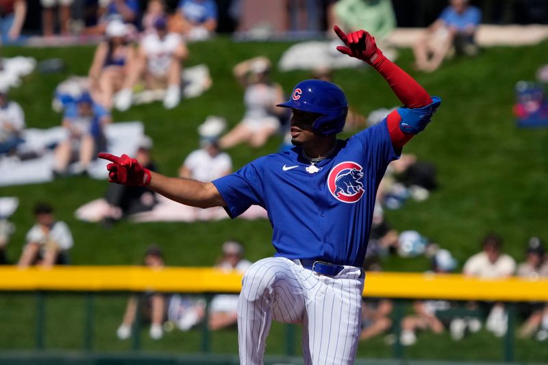 Feb 29, 2024; Mesa, Arizona, USA; Chicago Cubs second baseman Christopher Morel (5) reacts after hitting a double against the Colorado Rockies in the first inning at Sloan Park. Mandatory Credit: Rick Scuteri-USA TODAY Sports