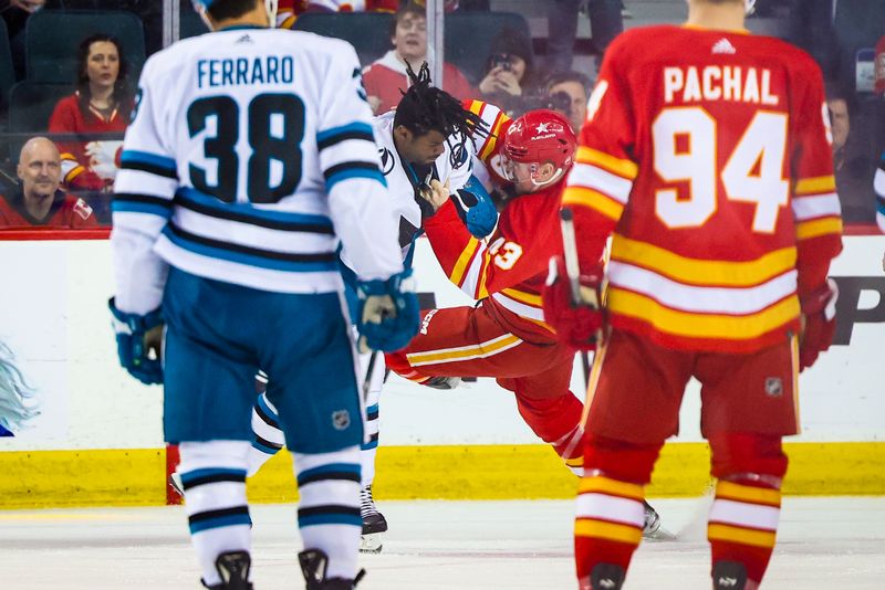 Apr 18, 2024; Calgary, Alberta, CAN; San Jose Sharks right wing Givani Smith (54) and Calgary Flames right wing Adam Klapka (43) fights during the second period at Scotiabank Saddledome. Mandatory Credit: Sergei Belski-USA TODAY Sports