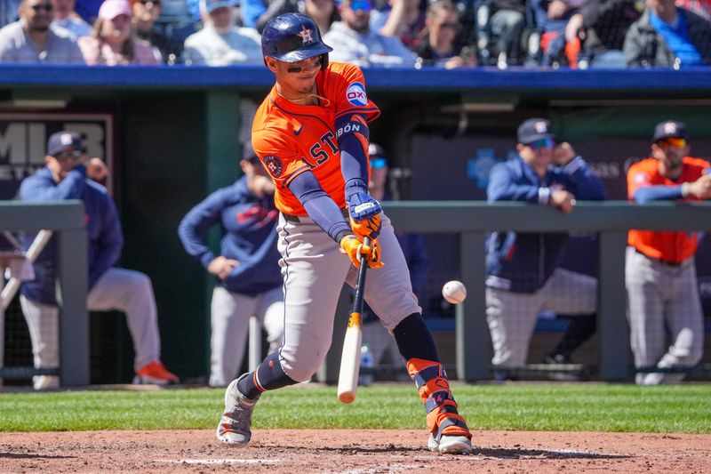 Apr 11, 2024; Kansas City, Missouri, USA; Houston Astros center fielder Mauricio Dubón (14) hits a one run single against the Kansas City Royals in the sixth inning at Kauffman Stadium. Mandatory Credit: Denny Medley-USA TODAY Sports