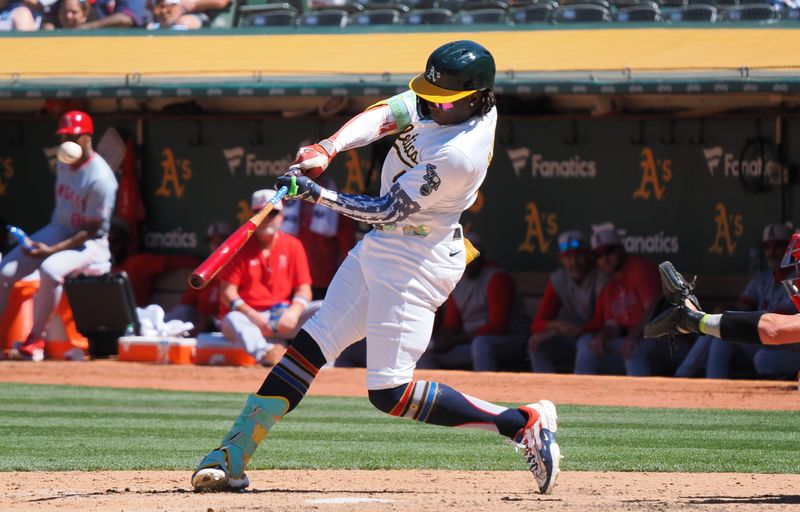 Jul 4, 2024; Oakland, California, USA; Oakland Athletics right fielder Lawrence Butler (4) hits a solo home run against the Los Angeles Angels during the eighth inning at Oakland-Alameda County Coliseum. Mandatory Credit: Kelley L Cox-USA TODAY Sports