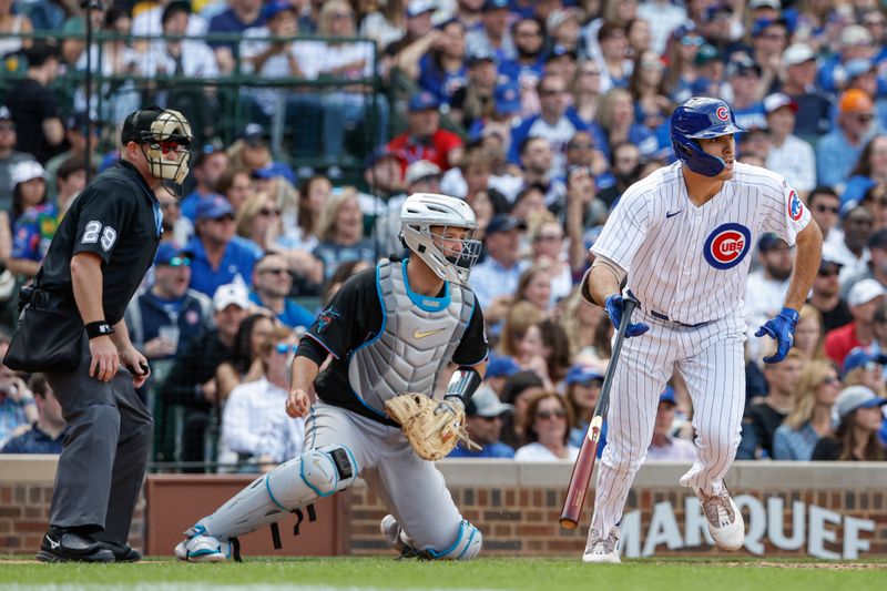 May 5, 2023; Chicago, Illinois, USA; Chicago Cubs first baseman Matt Mervis (22) watches his RBI-single against the Miami Marlins during the eight inning at Wrigley Field. Mandatory Credit: Kamil Krzaczynski-USA TODAY Sports